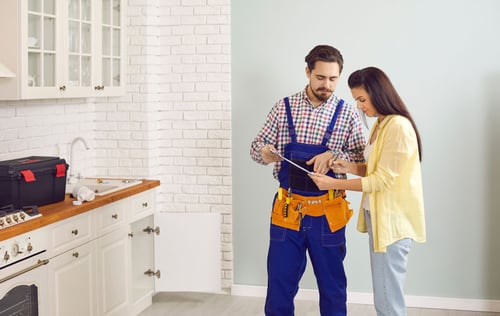 Inspector discussing property findings with a homeowner