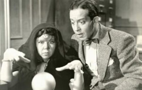 Black-and-white image of two people attempting to predict the future