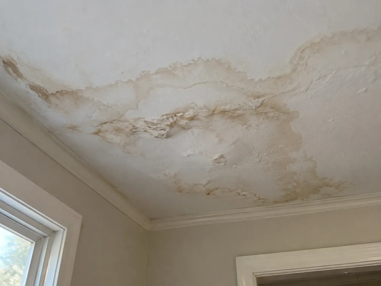Water staining and damage on a residential ceiling