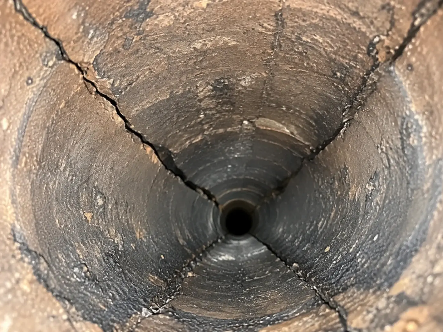 Cracked chimney flue liner visible during an internal video chimney inspection